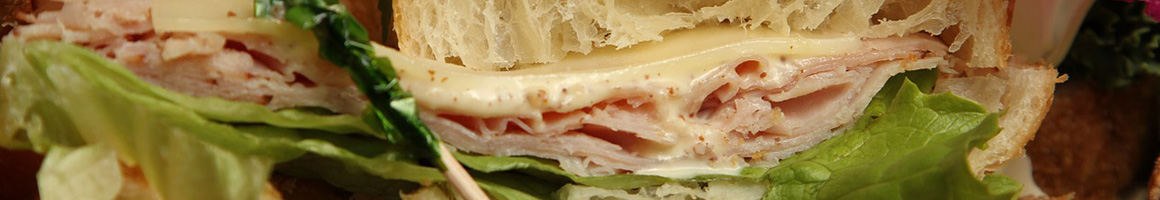 Eating Sandwich at Power Smoothie Aventura restaurant in Aventura, FL.
